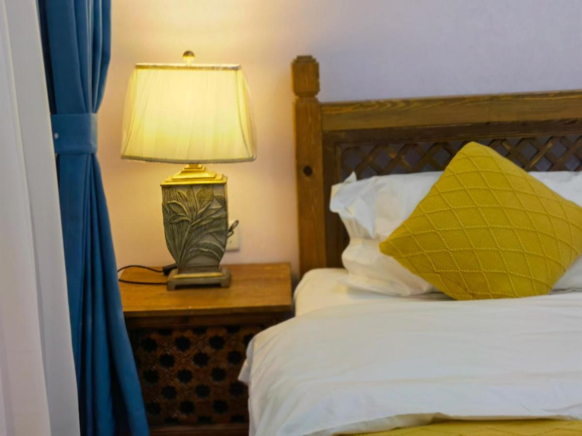 Mama Naxi Guesthouse Лиджанг Екстериор снимка